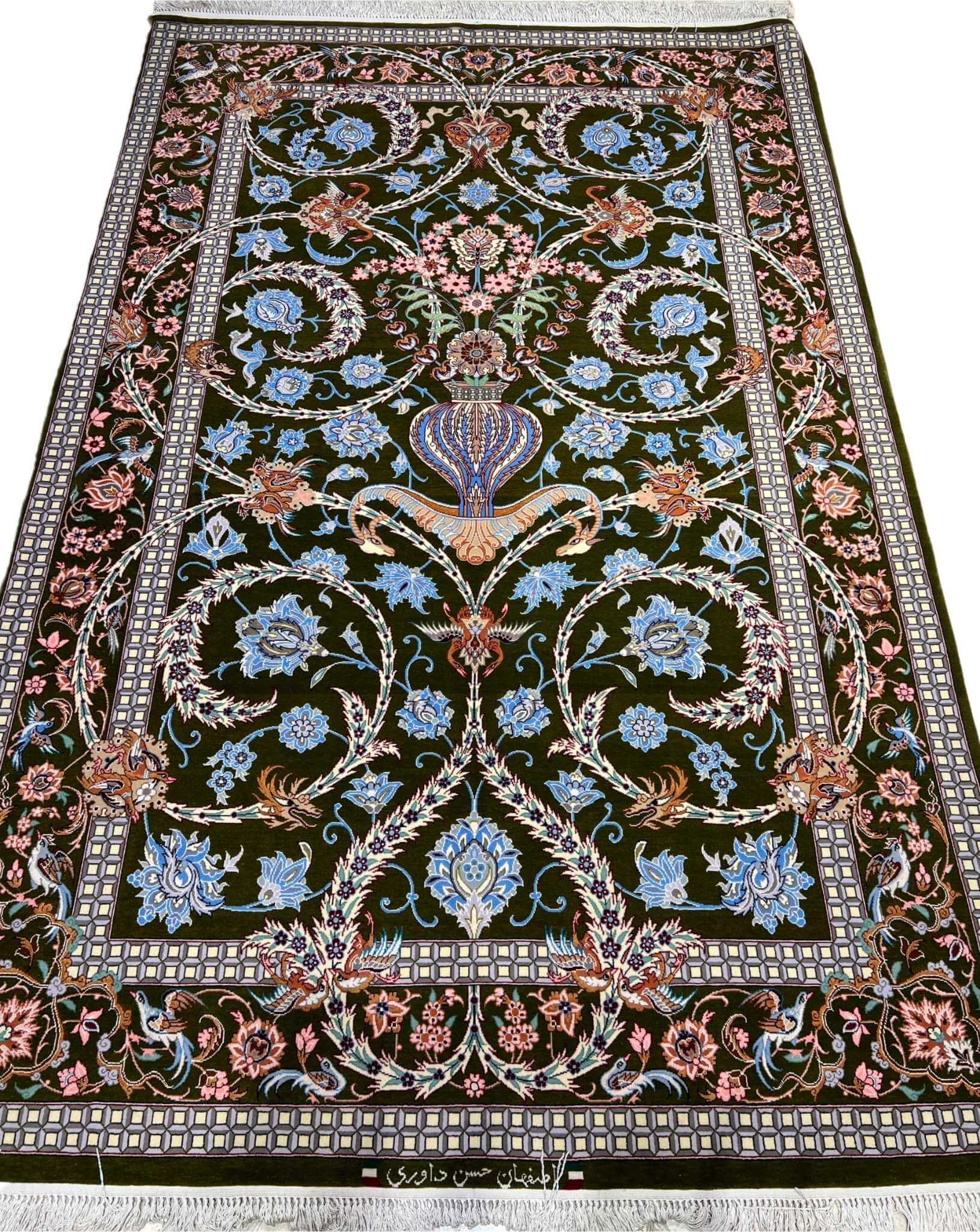 Persian Isfahan floral vase rug with emerald-green base.